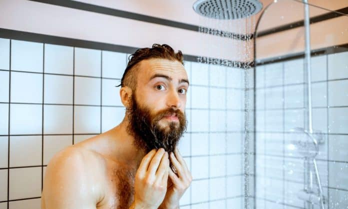 man cleaning beard in the shower man cleaning beard in the shower